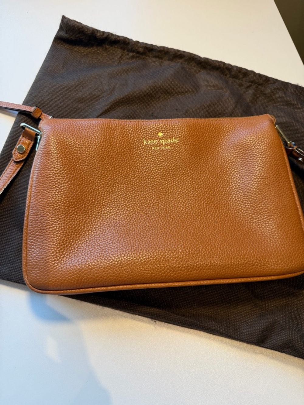 kate spade Pebbled Leather Messenger in Cognac Brown with Gold Logo